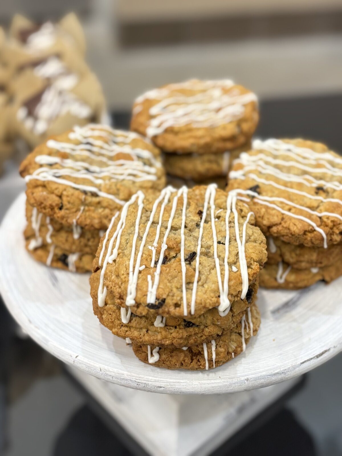 Freshly baked cookies arranged on a white cake stand