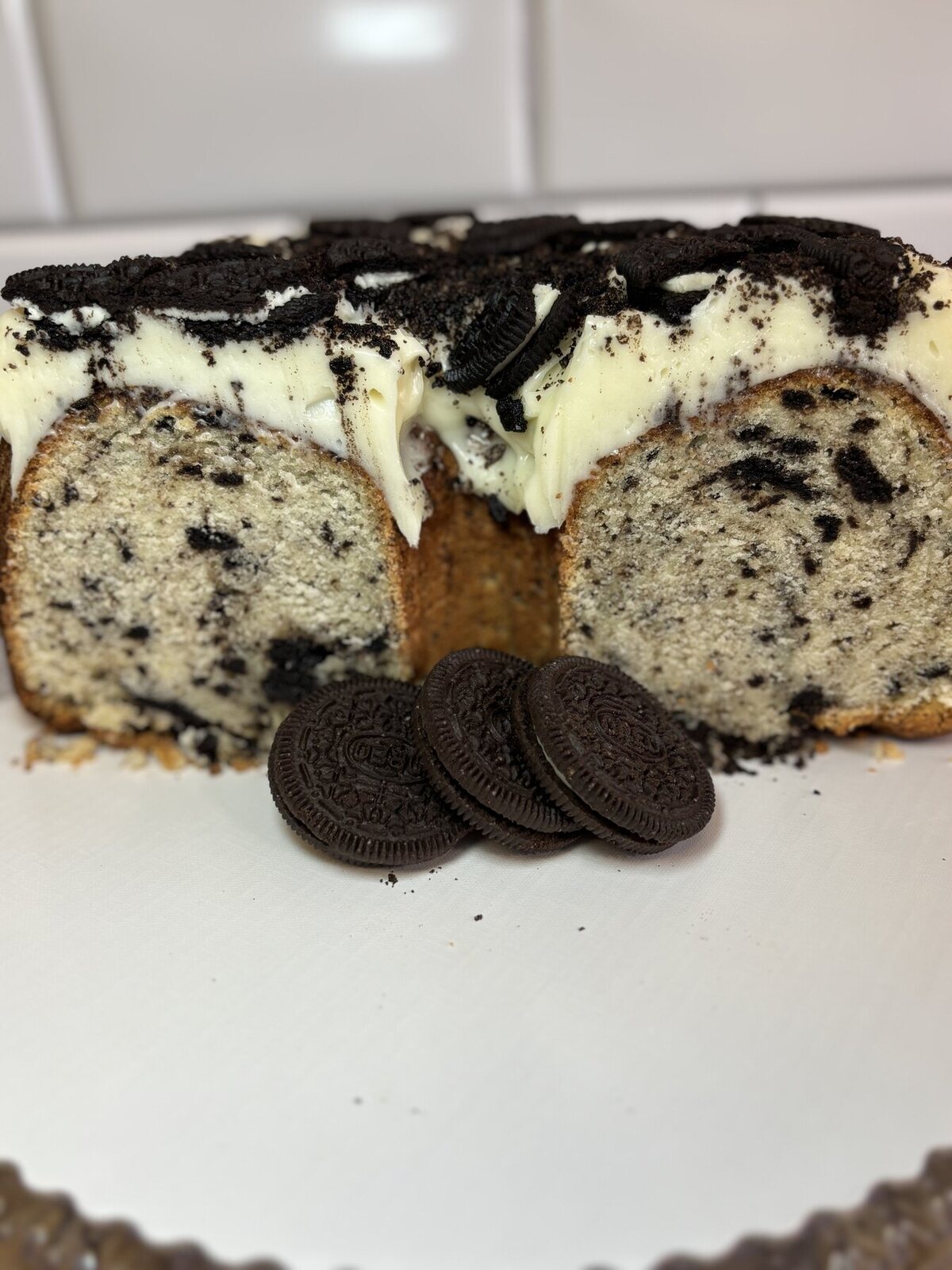 Cookies and cream pound cake topped with chocolate sandwich cookies